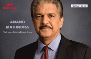 Anand Mahindra, Chairman of the Mahindra Group, photographed in formal attire against a neutral background.